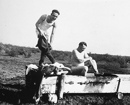 Cowboys bathing in a trough